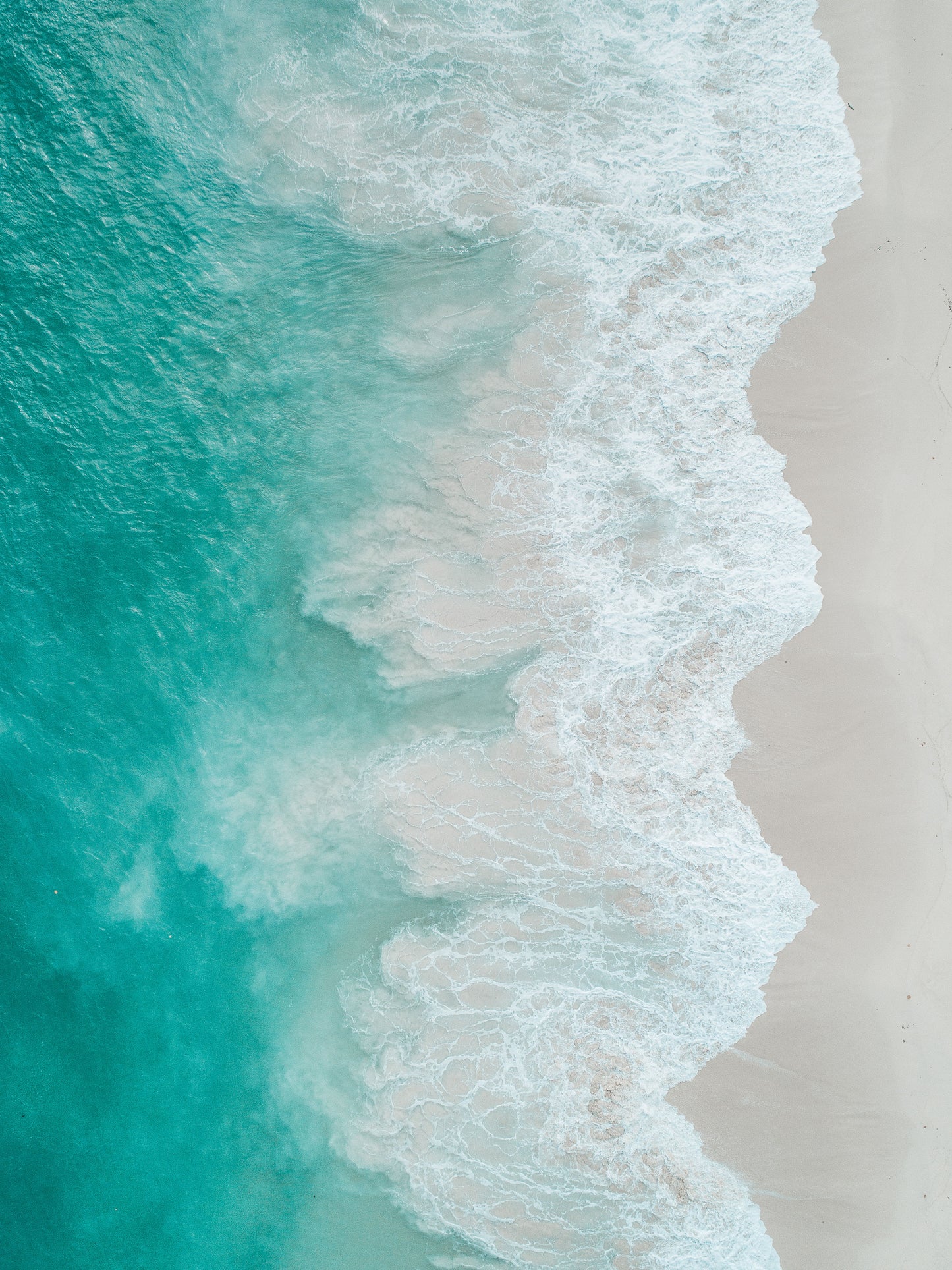 Drone shot of ocean waves crashing on to the beach- Gallery Frames