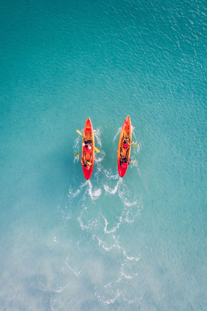 Drone view of 2 red kayak in turquoise ocean water - Gallery Frames